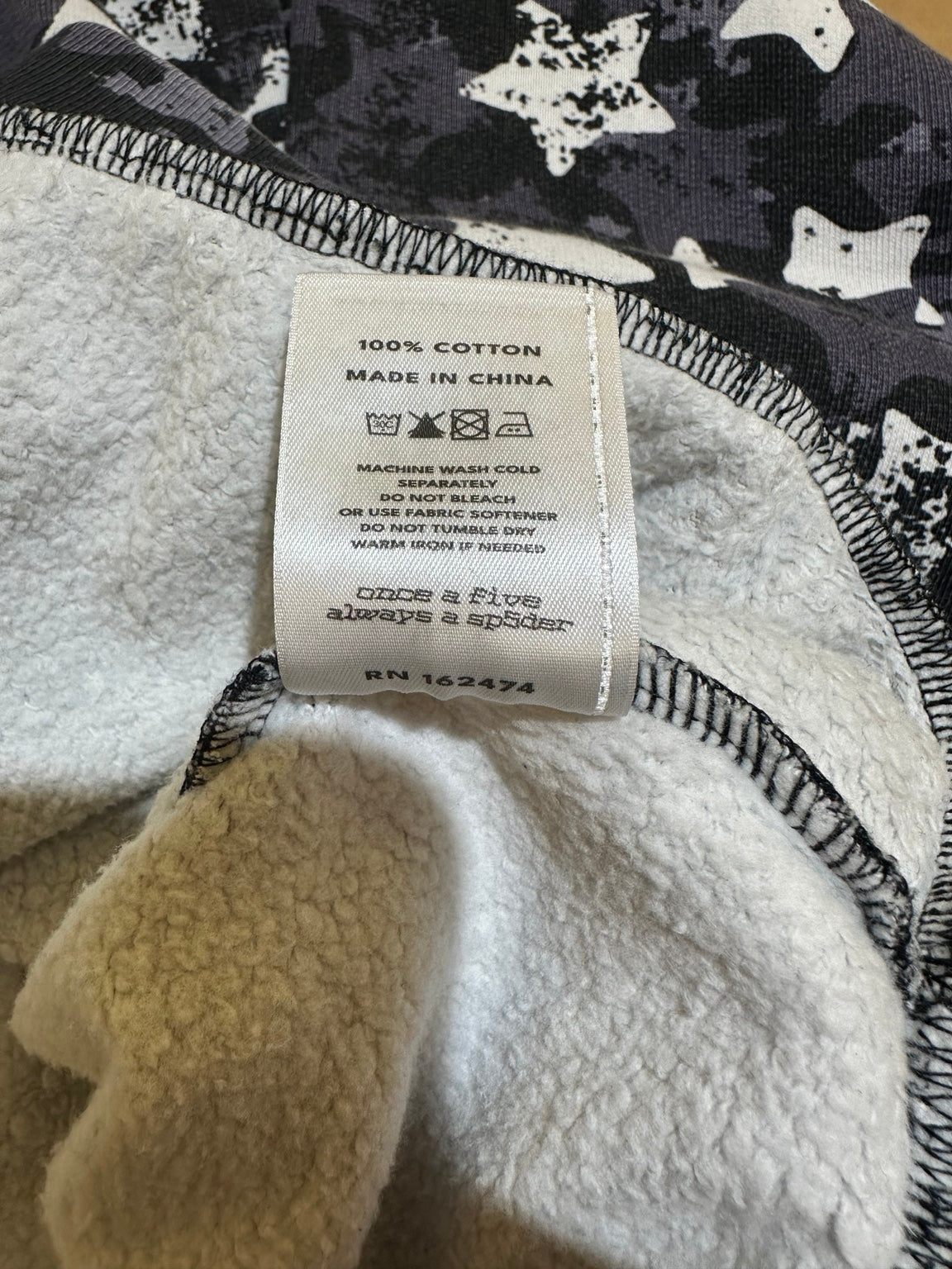 Sp5der 555 Star Camo Zip Up care tag