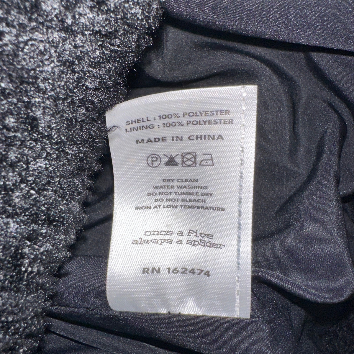 Sp5der Sherpa Puffer Jacket Black care tag
